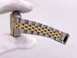 a person holding a watch in their hand