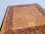 an image of a wooden table with a square design on the top