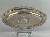 an image of a silver tray on a stand on a white surface
