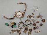 a lot of jewelry sitting on a white surface