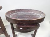 a wooden table with a bowl on top of it