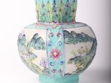 a vase that is sitting on a white surface