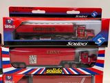 two boxed boxes of toy trucks sitting next to each other on a white surface