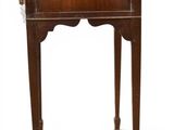 an old wooden table with a drawer on top of it