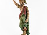 an old statue of a man with a hat on his head