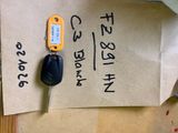 a piece of paper with a car key attached to it