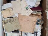 a box full of mail sitting on the floor