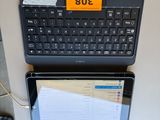 two laptops sitting next to each other on the wall