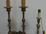 three candles that are sitting on a table