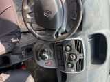 a car dashboard with a steering wheel and a dash board