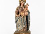 a statue of a woman holding a baby in her arms