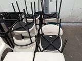 many chairs that are lined up in the parking lot