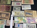 many different types of paper money on the table