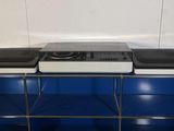 a blue shelf with two speakers on top of it
