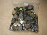 a bag of coins sitting on a table with a price tag on it