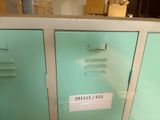 two metal lockers with labels on them in a room