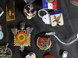 a lot of badges that are on a table