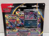 a close up of a box of pokemon cards on a white surface