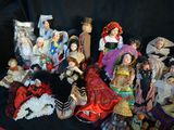 a lot of dolls that are sitting on a table