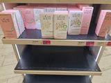 many boxes of beauty products on a shelf in a store