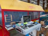 an image of a machine shop with a computer on it