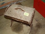 an old suitcase sitting on a small stool in a room