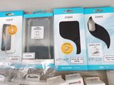 three packages of items that include a phone, earphones, and earplugs