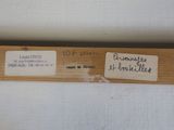 a close up of a piece of wood with a label on it