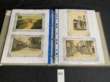 an open book with pictures of old buildings on it