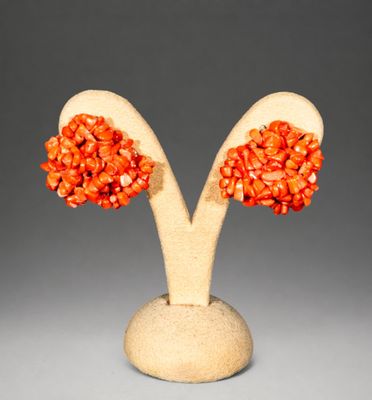 pair of orange coral earrings in the shape of two trees