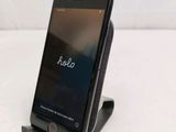 a cell phone that is sitting on top of a stand