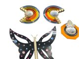 a butterfly that is sitting next to some other items