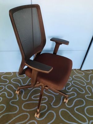 a brown office chair with a black seat and a brown seat