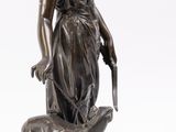 an image of a statue of a woman with a dog