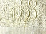 towel with a monogram on it on a white background