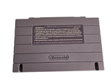 a close up of a nintendo game system on a white surface