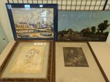 two framed pictures of a woman and a man on a table
