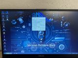 a laptop computer that is sitting on a desk