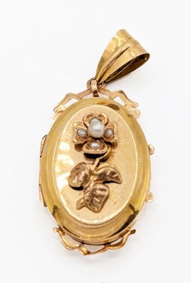 a close up of a gold locke with a flower on it