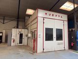 an image of a fire station with a fire hydrant in the background
