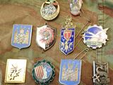 a lot of badges that are on a military uniform