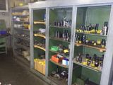 many bottles on the shelves in the room