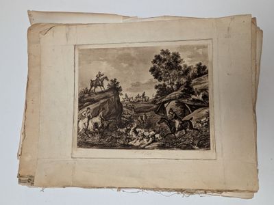an old book with a picture of a man on a horse in a field