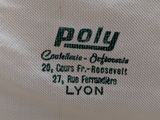 the back of a polo shirt with a black and white logo on it