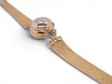 an image of a close up of a watch on a white surface