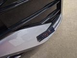 a close up of a car ' s bumper with a sticker on it