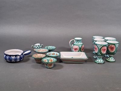 many different types of vases and dishes on the table