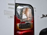 a close up of the tail light of a white van