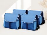 three blue and black bags sitting on top of a white table