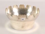 a silver bowl that is sitting on a table